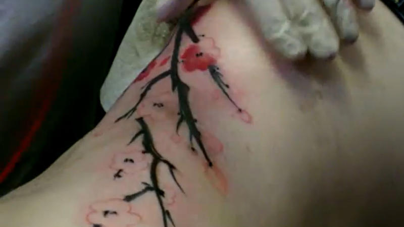 1. Dainty Butterfly On Collarbone, 2. Tiny Heart Outline On Wrist, 3. Mini Moon Behind The Ear, 4. Feather On Inner Forearm, 5. Tiny Rose On Finger, 6. Single Star On Ankle, 7. Mini Crown On Nape, 8. Cherry Blossom On Ribcage, 9. Tiny Paw Print On Foot, 10. Dandelion With Blowing Seeds, 11. Angel Wings On The Back Of The Arm, 12. Tiny Script Word On Collarbone, 13. Tiny Rainbow On Wrist, 14. Wine Glass On Hip, 15. Anchor On Side Rib, 16. Music Note Behind The Ear, 17. Lavender Sprig On Arm, 18. Infinity Symbol With Initials, 19. Tiny Mushroom Cluster On Ankle, 20. Cupcake With Cherry On Top On Hip