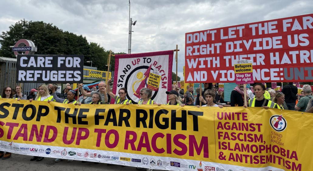 Pictured: Anti-migrant protesters gather outside Britannia Hotel in Canary Wharf, Pictured: Anti-migrant protesters gather outside Bell Hotel in Epping, Protesters and counter-demonstrators gather in Epping, Pictured: Stand Up To Racism crowd grows ahead of Epping protest, Canary Wharf locals protest use of Britannia hotel for migrants, Two men charged with public order offence after Diss hotel protest, Pictured: Police gather in Epping ahead of migrant hotel protests, Poll reveals British view on small boat crossings, Residents feel 'trapped' as harassment fears grow around migrant hotel protests, Nigel Farage apologises after false Epping protest claim, Elite police division monitoring social media to prevent Epping unrest, What caused the Epping anti-migration protests?, Essex police announces plan for Epping protests, Protests organised by members of Neo-Nazi groups, Police announce new protest restrictions to tackle unrest, Asylum seekers afraid to leave hotel amid protests