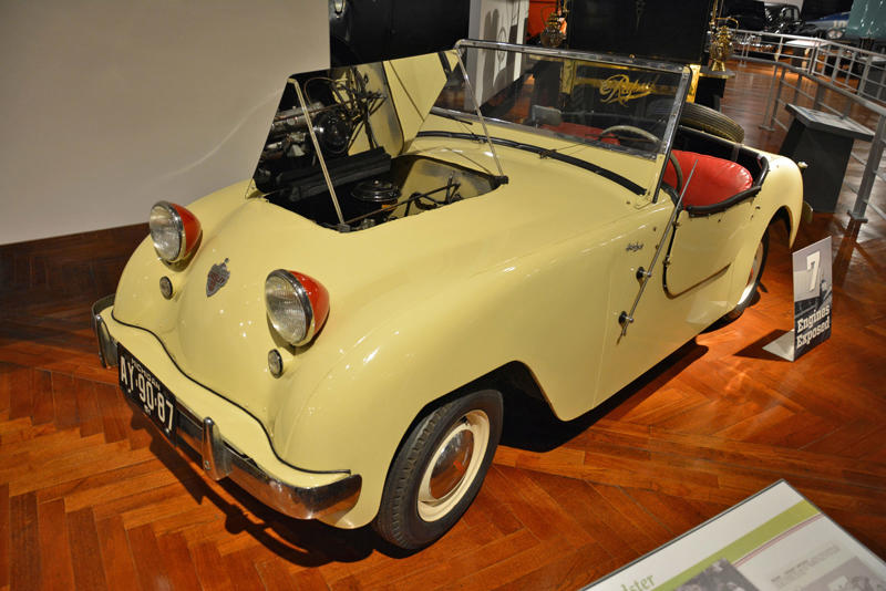 Crosley Hotshot (1951) Roper steam carriage (1865), Ford 999 (1902), Holsman Runabout (1903), Scripps-Booth Rocket (1913), Detroit-Electric Model 47 (1914), Brewster Town Landaulet (1915), Chevrolet Royal Mail (1915), Woods Dual-Power (1916), Chrysler B-70 (1924), Essex Coach (1924), Ford Flivver (1926), Blue Bird school bus (1927), Lincoln Zephyr (1936), Lincoln Bubbletop (1950), Crosley Hotshot (1951), Chrysler 300-B (1956), Cornell-Liberty Safety Car (1957), Ford Mustang I concept (1962), Buick Riviera (1963), Chrysler turbine car (1963), Ford Mustang (1965), Toyota Corona (1966), Ford Mark IV (1967), Mercury Cougar (1968), Lincoln presidential limousine (1972), Chrysler Newport (1973), Dodge Omni (1978), Comuta-Car (1980), Ford Escort (1981), Plymouth Voyager (1984), Ford Taurus (1986), General Motors EV1 (1997), Toyota Prius (1997), Ford Focus Electric (2009)