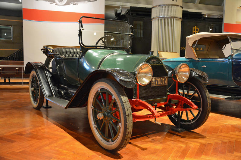 Chevrolet Royal Mail (1915) Roper steam carriage (1865), Ford 999 (1902), Holsman Runabout (1903), Scripps-Booth Rocket (1913), Detroit-Electric Model 47 (1914), Brewster Town Landaulet (1915), Chevrolet Royal Mail (1915), Woods Dual-Power (1916), Chrysler B-70 (1924), Essex Coach (1924), Ford Flivver (1926), Blue Bird school bus (1927), Lincoln Zephyr (1936), Lincoln Bubbletop (1950), Crosley Hotshot (1951), Chrysler 300-B (1956), Cornell-Liberty Safety Car (1957), Ford Mustang I concept (1962), Buick Riviera (1963), Chrysler turbine car (1963), Ford Mustang (1965), Toyota Corona (1966), Ford Mark IV (1967), Mercury Cougar (1968), Lincoln presidential limousine (1972), Chrysler Newport (1973), Dodge Omni (1978), Comuta-Car (1980), Ford Escort (1981), Plymouth Voyager (1984), Ford Taurus (1986), General Motors EV1 (1997), Toyota Prius (1997), Ford Focus Electric (2009)