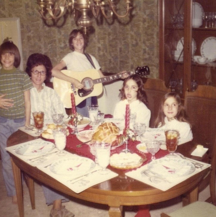 Oh No, He Brought the Guitar Again The Thanksgiving That Started at 6AM, When Dinner Was an Event, Not Just a Meal, Queen of the Kitchen: Grandma, Dad Wasn't Talking, He Was Eating, Men Sat. Women Ran the Show., Grandpa Fed Grandma and We All Looked Away, Thanksgiving: AKA The Super Bowl of Eating, Dinner Was Ready. You Came Running., Cowboys at the Kids’ Table, No Talking. Just Chewing., Men Set the Table... Once, The Rolls Were Sacred. Don’t Touch Until Grace., Little Miss No-Fork Energy, When She Brought ‘The Boyfriend’, Holiday Dinners Hit Different, Everyone Was There (Even That One Cousin), The Angry Teen at the Kids’ Table, Why Is There a Creepy Doll at the Table?, Oh No, He Brought the Guitar Again, The Table Where Everything Happened, Hot Meal. Hotter Drama., Not Quite Kids, Not Quite Teens, Dad and the Wine Bottle: A Love Story, Baby’s First Fork