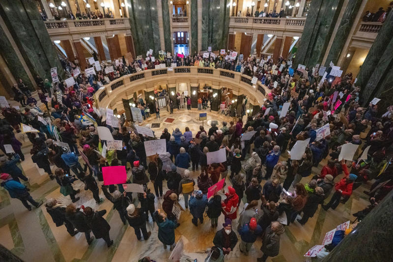 Reproductive rights rally at Capitol in Madison Courtroom and gavel, Wisconsin Supreme Court Justices at debate event, Reproductive rights rally at Capitol in Madison, Justice Jill J. Karofsky during oral arguments, Congressmen Gallagher and Pocan discuss bipartisanship, Security outside the Wisconsin Supreme Court, Susan Crawford speaks at election night watch party, Sam Hirsch comments at Supreme Court hearing