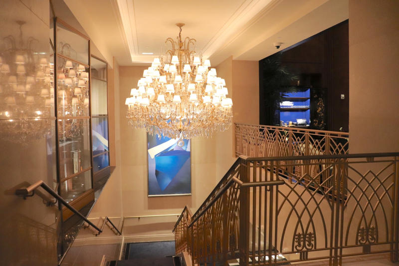 Stairs from the porte-cochère, where guests arrive, lead straight into the check-in area.
