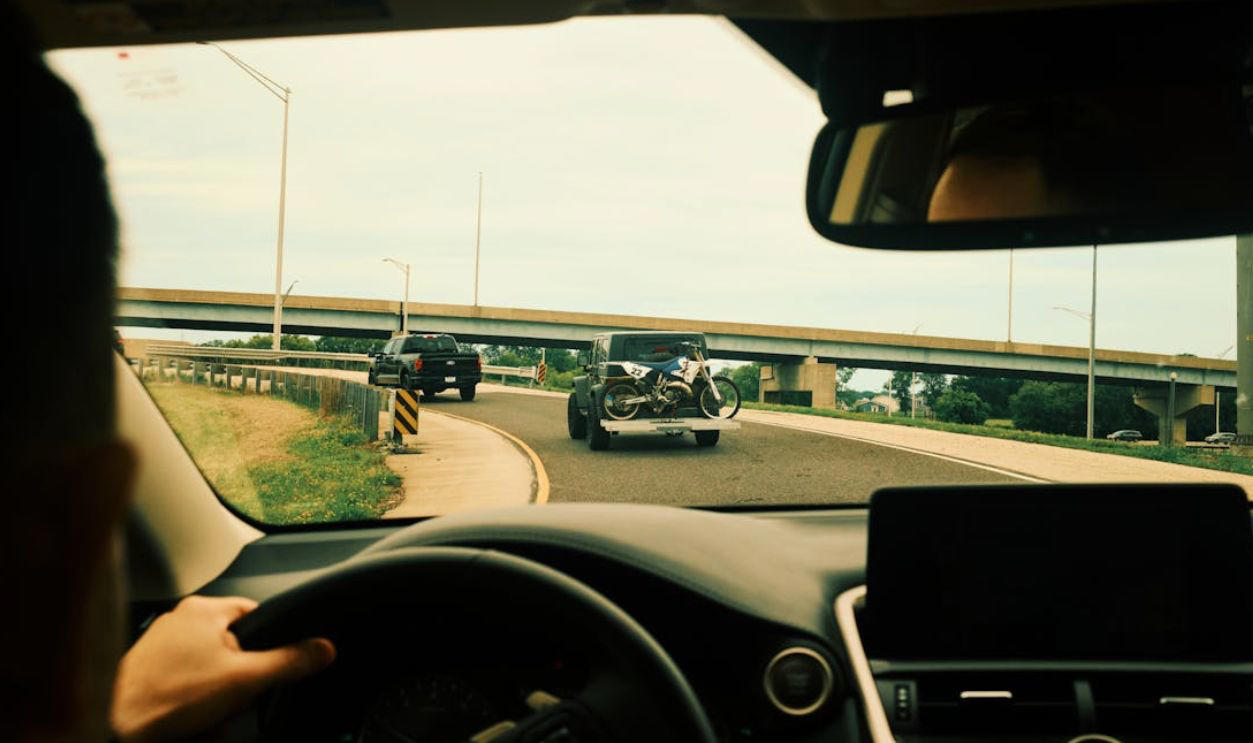 Still Road-Ready—Or Rusty Behind the Wheel?, Q: What does a flashing red traffic light mean?, Q: When are you allowed to pass another vehicle on the right?, A: When the car ahead is turning left, A: Stop completely, regardless of your direction, A: 0.08%, Q: When should you turn your headlights on?, A: At night or in poor visibility, A: No passing in either direction, Q: When merging onto a freeway, who has the right of way?, A: Vehicles already on the freeway, Q: What should you do if your vehicle starts to hydroplane?, A: Ease off the gas and steer straight, Q: What is the hand signal for a left turn?, A: Left arm extended straight out