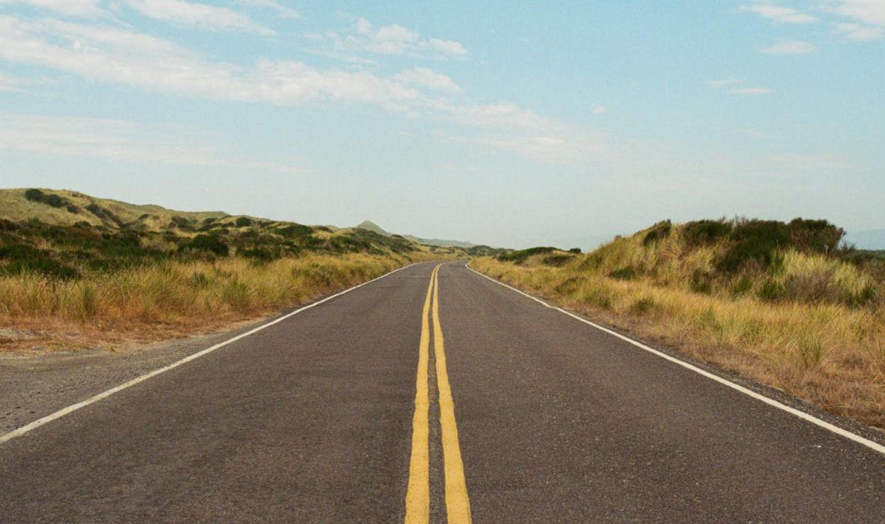 Still Road-Ready—Or Rusty Behind the Wheel?, Q: What does a flashing red traffic light mean?, Q: When are you allowed to pass another vehicle on the right?, A: When the car ahead is turning left, A: Stop completely, regardless of your direction, A: 0.08%, Q: When should you turn your headlights on?, A: At night or in poor visibility, A: No passing in either direction, Q: When merging onto a freeway, who has the right of way?, A: Vehicles already on the freeway, Q: What should you do if your vehicle starts to hydroplane?, A: Ease off the gas and steer straight, Q: What is the hand signal for a left turn?, A: Left arm extended straight out