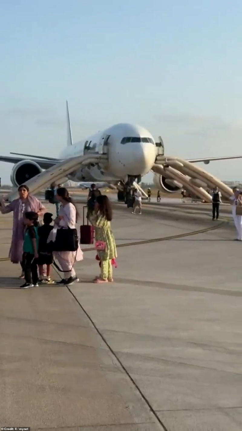 Passengers flee jet after it bursts into flames