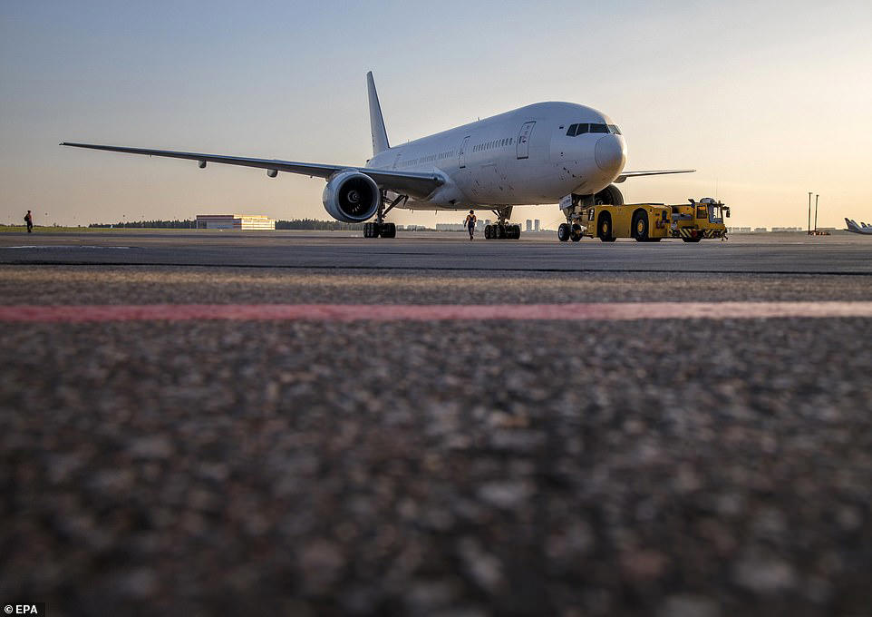 Passengers flee jet after it bursts into flames