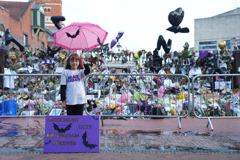Ozzy Osbourne's funeral - key points, How to watch the Black Sabbath bench livestream, PICTURES: Fans line the streets of Birmingham ahead of Ozzy funeral procession, VIDEO: Ozzy Osbourne reveals the song that changed his life, Yungblud's moving tribute to Ozzy, Thousands of fans travel to Birmingham... and the pints are already flowing, Mayor calls Ozzy Osbourne 'a son of Birmingham', Ozzy fan renames his pet 'Doggy Osbourne' for the day, 'Ozzy Osbourne was completely himself... money didn't change him', Ozzy Osbourne flung open hell’s musical gates – and changed the world, Couple Karen and Steve Brookhouse: 'There will never be another Ozzy', Hundreds of people are already gathered at the barriers, Ozzy Osbourne wanted his funeral to be ‘celebration, not a mope-fest’, Graffiti artist Mr Murals helps touch up murals before the funeral procession, What Ozzy's fellow artists said in tributes after his death, Senior reporter Holly Evans is in Birmingham ahead of the funeral procession, Fans prepare to say final goodbye to the Prince of Darkness, Who are Bostin' Brass Band, the group playing alongside Ozzy's hearse?, Flowers, tributes and a brass band outside the Black Sabbath bench, Birmingham mayor describes Ozzy Osbourne as 'son of Birmingham, In pictures: Fans arrive and floral tributes laid ahead of funeral