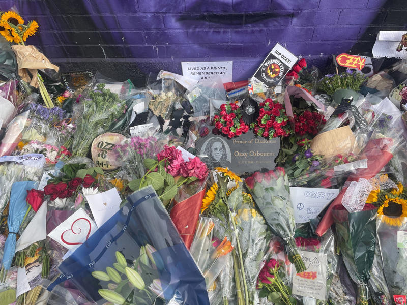 Ozzy Osbourne's funeral - key points, How to watch the Black Sabbath bench livestream, PICTURES: Fans line the streets of Birmingham ahead of Ozzy funeral procession, VIDEO: Ozzy Osbourne reveals the song that changed his life, Yungblud's moving tribute to Ozzy, Thousands of fans travel to Birmingham... and the pints are already flowing, Mayor calls Ozzy Osbourne 'a son of Birmingham', Ozzy fan renames his pet 'Doggy Osbourne' for the day, 'Ozzy Osbourne was completely himself... money didn't change him', Ozzy Osbourne flung open hell’s musical gates – and changed the world, Couple Karen and Steve Brookhouse: 'There will never be another Ozzy', Hundreds of people are already gathered at the barriers, Ozzy Osbourne wanted his funeral to be ‘celebration, not a mope-fest’, Graffiti artist Mr Murals helps touch up murals before the funeral procession, What Ozzy's fellow artists said in tributes after his death, Senior reporter Holly Evans is in Birmingham ahead of the funeral procession, Fans prepare to say final goodbye to the Prince of Darkness, Who are Bostin' Brass Band, the group playing alongside Ozzy's hearse?, Flowers, tributes and a brass band outside the Black Sabbath bench, Birmingham mayor describes Ozzy Osbourne as 'son of Birmingham, In pictures: Fans arrive and floral tributes laid ahead of funeral