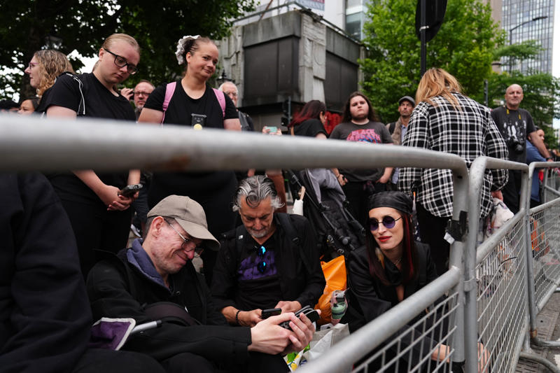 Ozzy Osbourne's funeral - key points, How to watch the Black Sabbath bench livestream, PICTURES: Fans line the streets of Birmingham ahead of Ozzy funeral procession, VIDEO: Ozzy Osbourne reveals the song that changed his life, Yungblud's moving tribute to Ozzy, Thousands of fans travel to Birmingham... and the pints are already flowing, Mayor calls Ozzy Osbourne 'a son of Birmingham', Ozzy fan renames his pet 'Doggy Osbourne' for the day, 'Ozzy Osbourne was completely himself... money didn't change him', Ozzy Osbourne flung open hell’s musical gates – and changed the world, Couple Karen and Steve Brookhouse: 'There will never be another Ozzy', Hundreds of people are already gathered at the barriers, Ozzy Osbourne wanted his funeral to be ‘celebration, not a mope-fest’, Graffiti artist Mr Murals helps touch up murals before the funeral procession, What Ozzy's fellow artists said in tributes after his death, Senior reporter Holly Evans is in Birmingham ahead of the funeral procession, Fans prepare to say final goodbye to the Prince of Darkness, Who are Bostin' Brass Band, the group playing alongside Ozzy's hearse?, Flowers, tributes and a brass band outside the Black Sabbath bench, Birmingham mayor describes Ozzy Osbourne as 'son of Birmingham, In pictures: Fans arrive and floral tributes laid ahead of funeral