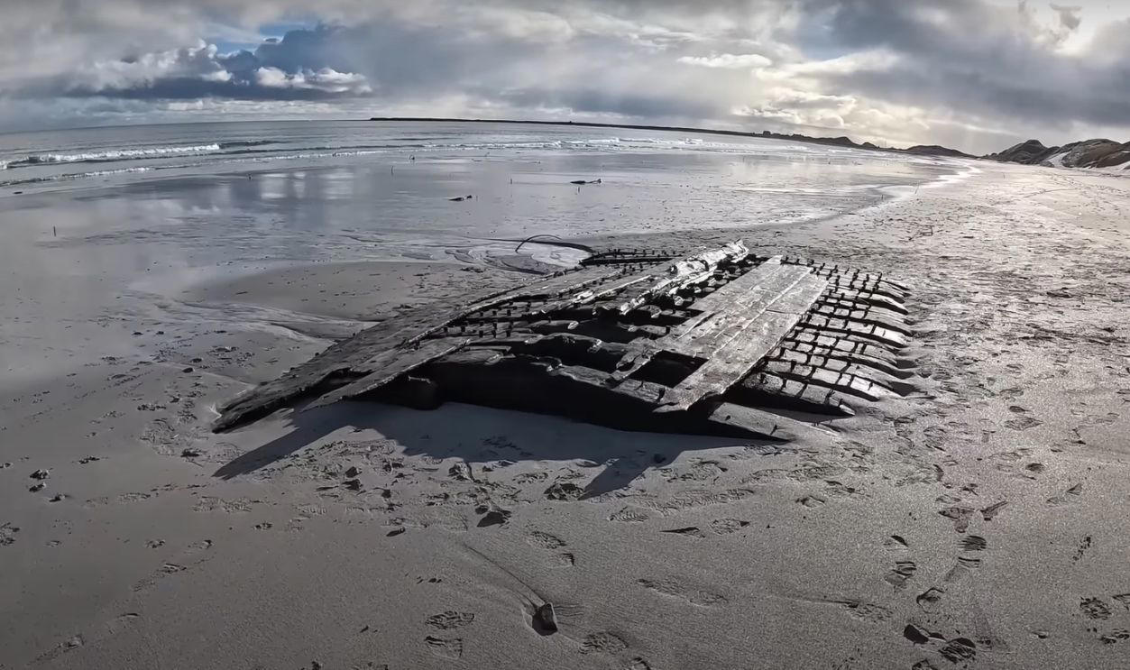A Shipwreck That Spoke Volumes, Storms Reshape The Sanday Coastline, Unusual Timbers Revealed By The Tide, Discovery Credited To A Local Schoolboy, Discovery Credited To A Local Schoolboy (Cont.), Islanders Mobilize To Recover The Remains, Timbers Were Hauled To Safety By Hand And Tractor, Dendrochronology Pinpoints The Era, Dendrochronology Pinpoints The Era (Cont.), Wessex Archaeology Takes The Lead On Study, Microscopic Grain Patterns Support Naval Origin, Archival Clues Narrow The Field To HMS Hind, Archival Clues Narrow The Field To HMS Hind (Cont.), A War Frigate Built For Empire, A War Frigate Built For The Empire (Cont.), She Crossed Oceans Under The Union Jack, A Whaling Vessel Venturing To The North, The Crew Faced Ice, Isolation, And Peril, March 1788 Marks The End, All 56 Sailors Survived The Ordeal, Lopness Bay Became A Silent Tomb, Folklore Preserved Fragments Of The Tale, Funding Secured For Long-Term Study, Funding Secured For Long-Term Study (Cont.), The Community Leads Its Own Maritime Revival