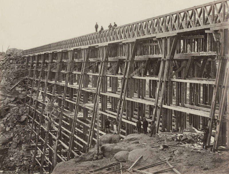 7. The Dale Creek Crossing, a wooden railroad, under construction during the building of the Transcontinental Railroad, 1868 1. The day the Transcontinental Railroad was officially completed in Colorado, August 15, 1870, 2. A Native American looking down on the newly completed section of the Transcontinental Railroad, 3. Celebrating the completion of the Transcontinental Railroad in Promontory Point, Utah, 1869, 4. Hopping on the handcar to get to work on the Transcontinental Railroad, 1860s, 5. All hands on deck, 1864, 6. Laborers laid an average of ten miles of track per day, 7. The Dale Creek Crossing, a wooden railroad, under construction during the building of the Transcontinental Railroad, 1868, 8. Heading to the tracks to witness the completion of the railroad, 1870, 9. The Jupiter train, which was one of the first locomotives on the Transcontinental Railroad, 1860s, 10. Workers had to cut through 1,000 miles of trees through the narrows of Weber Canyon, 1869, 11. Checking to see if there would be any rock slides onto the railroad, 12. The Central Pacific First Transcontinental Railroad, built from Sacramento, California, to Summit, Utah in 1865, 13. A railroad camp near Victory, 1869, 14. Would you trust this bridge on the Central Pacific side of the Transcontinental Railroad?, 15. Imagine all of the work that went into digging through that mountain