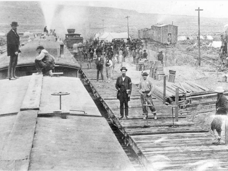 13. A railroad camp near Victory, 1869 1. The day the Transcontinental Railroad was officially completed in Colorado, August 15, 1870, 2. A Native American looking down on the newly completed section of the Transcontinental Railroad, 3. Celebrating the completion of the Transcontinental Railroad in Promontory Point, Utah, 1869, 4. Hopping on the handcar to get to work on the Transcontinental Railroad, 1860s, 5. All hands on deck, 1864, 6. Laborers laid an average of ten miles of track per day, 7. The Dale Creek Crossing, a wooden railroad, under construction during the building of the Transcontinental Railroad, 1868, 8. Heading to the tracks to witness the completion of the railroad, 1870, 9. The Jupiter train, which was one of the first locomotives on the Transcontinental Railroad, 1860s, 10. Workers had to cut through 1,000 miles of trees through the narrows of Weber Canyon, 1869, 11. Checking to see if there would be any rock slides onto the railroad, 12. The Central Pacific First Transcontinental Railroad, built from Sacramento, California, to Summit, Utah in 1865, 13. A railroad camp near Victory, 1869, 14. Would you trust this bridge on the Central Pacific side of the Transcontinental Railroad?, 15. Imagine all of the work that went into digging through that mountain