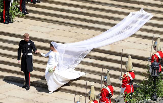 It took 3,900 hours of work by 50 people., Dressmakers had to wash their hands every 30 minutes while making Meghan's 16-foot-veil., Meghan's wedding-day tiara was the last royal tiara she ever wore., The dress featured a hidden, sentimental "something blue.", Meghan's second wedding dress was a Stella McCartney halter gown.