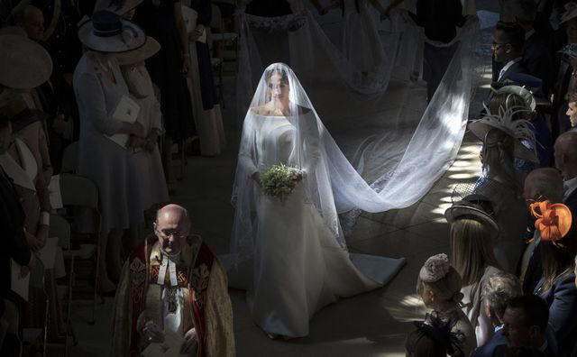 It took 3,900 hours of work by 50 people., Dressmakers had to wash their hands every 30 minutes while making Meghan's 16-foot-veil., Meghan's wedding-day tiara was the last royal tiara she ever wore., The dress featured a hidden, sentimental "something blue.", Meghan's second wedding dress was a Stella McCartney halter gown.