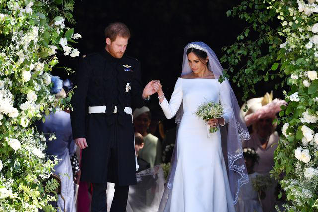 It took 3,900 hours of work by 50 people., Dressmakers had to wash their hands every 30 minutes while making Meghan's 16-foot-veil., Meghan's wedding-day tiara was the last royal tiara she ever wore., The dress featured a hidden, sentimental "something blue.", Meghan's second wedding dress was a Stella McCartney halter gown.
