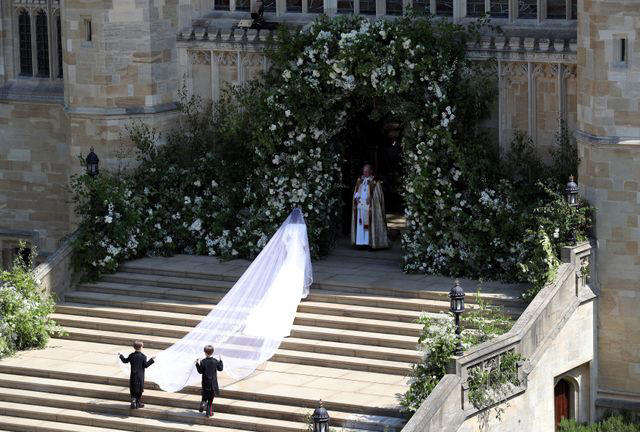 It took 3,900 hours of work by 50 people., Dressmakers had to wash their hands every 30 minutes while making Meghan's 16-foot-veil., Meghan's wedding-day tiara was the last royal tiara she ever wore., The dress featured a hidden, sentimental "something blue.", Meghan's second wedding dress was a Stella McCartney halter gown.