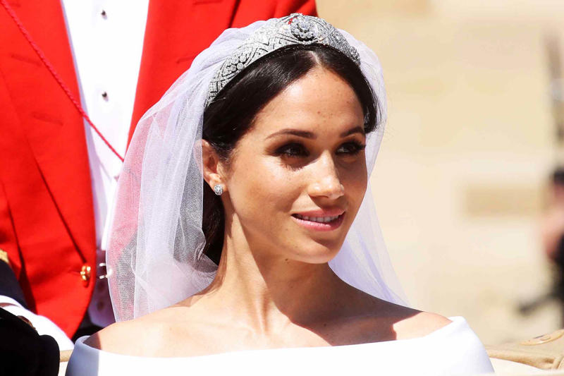 It took 3,900 hours of work by 50 people., Dressmakers had to wash their hands every 30 minutes while making Meghan's 16-foot-veil., Meghan's wedding-day tiara was the last royal tiara she ever wore., The dress featured a hidden, sentimental "something blue.", Meghan's second wedding dress was a Stella McCartney halter gown.