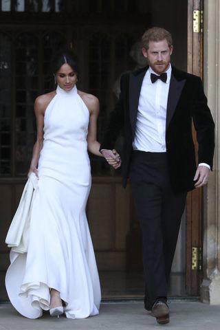 It took 3,900 hours of work by 50 people., Dressmakers had to wash their hands every 30 minutes while making Meghan's 16-foot-veil., Meghan's wedding-day tiara was the last royal tiara she ever wore., The dress featured a hidden, sentimental "something blue.", Meghan's second wedding dress was a Stella McCartney halter gown.