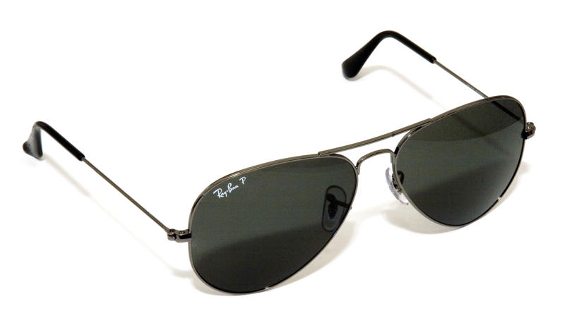 1. Ray-Ban Aviators in Top Gun, 2. John Lennon's Signature Circular Shades, 3. Elton John's Flamboyant On-Stage Specs, 4. Audrey Hepburn's Oversized, Window-shopping Shades, 5. Jackie Onassis: America's Coolest First Lady, 6. Lawrence Fishburn's Matrix Clip-on Look, 7. The Blues Brothers' Ray-Ban Wayfarers, 8. Madonna's Lives in a Material, Cat-eye World, 9. Andy Warhol's Chunky Black Frames, 10. Kurt Cobain's White "Clout Goggles", 11. Cyclops' Futuristic and Highly Necessary Visor, 12. Michael Jackson's Trademark Tour Aviators, 13. Bono's Tinted Rock Star Wrap-arounds, 14. James Dean's Rebellious, Rounded Sunglasses, 15. The Men in Black's Simple Black Shades