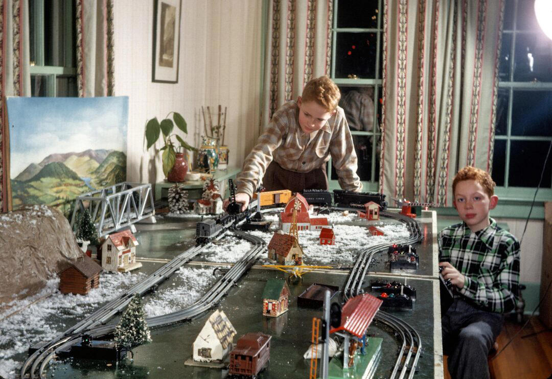 1. Boys Setting Up Their Train Model (1946) 1. Boys Setting Up Their Train Model (1946), 2. Dangerous Curves (1949), 3. Before Prom (1967), 4. Going for a Ride in the Convertible (1957), 5. Enjoying a Day at the Public Pool (1960s), 6. Mespelbrunn Castle in Bavaria, Germany, 7. Diving Contest in Palm Beach, Florida (1959), 8. Waiting on a Prom Date (1950s), 9. A Husband’s Portrait of His Wife (1954), 10. Times Square (1959), 11. Little Girl Fishing on the North Shore of Oahu (1960), 12. Couple on Vacation in Florida (1950s), 13. A Baker and His Bread (1950s), 14. Kids Posing by Their Family Vehicle (1966), 15. Brothers Playing in the Snow (1963), 16. Dogs Like Rides Too (1962), 17. Orphan Children from Mooseheart, Illinois (1948), 18. Stopping at Texaco on a Road Trip (1958), 19. Toddler Walking Around in Flowers (1954), 20. Boys on a Camping Trip (1965), 21. Saying Goodbye to Grandma (1950), 22. Picnic in France (1969), 23. A Night at the Bar (1950s), 24. Typical Teen Party (1978)