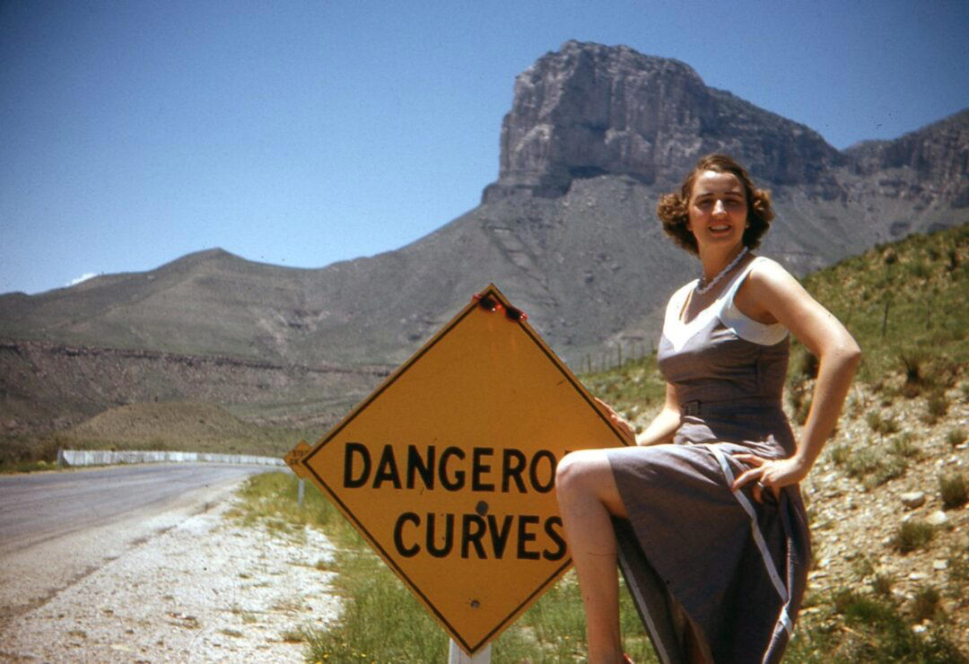 2. Dangerous Curves (1949) 1. Boys Setting Up Their Train Model (1946), 2. Dangerous Curves (1949), 3. Before Prom (1967), 4. Going for a Ride in the Convertible (1957), 5. Enjoying a Day at the Public Pool (1960s), 6. Mespelbrunn Castle in Bavaria, Germany, 7. Diving Contest in Palm Beach, Florida (1959), 8. Waiting on a Prom Date (1950s), 9. A Husband’s Portrait of His Wife (1954), 10. Times Square (1959), 11. Little Girl Fishing on the North Shore of Oahu (1960), 12. Couple on Vacation in Florida (1950s), 13. A Baker and His Bread (1950s), 14. Kids Posing by Their Family Vehicle (1966), 15. Brothers Playing in the Snow (1963), 16. Dogs Like Rides Too (1962), 17. Orphan Children from Mooseheart, Illinois (1948), 18. Stopping at Texaco on a Road Trip (1958), 19. Toddler Walking Around in Flowers (1954), 20. Boys on a Camping Trip (1965), 21. Saying Goodbye to Grandma (1950), 22. Picnic in France (1969), 23. A Night at the Bar (1950s), 24. Typical Teen Party (1978)