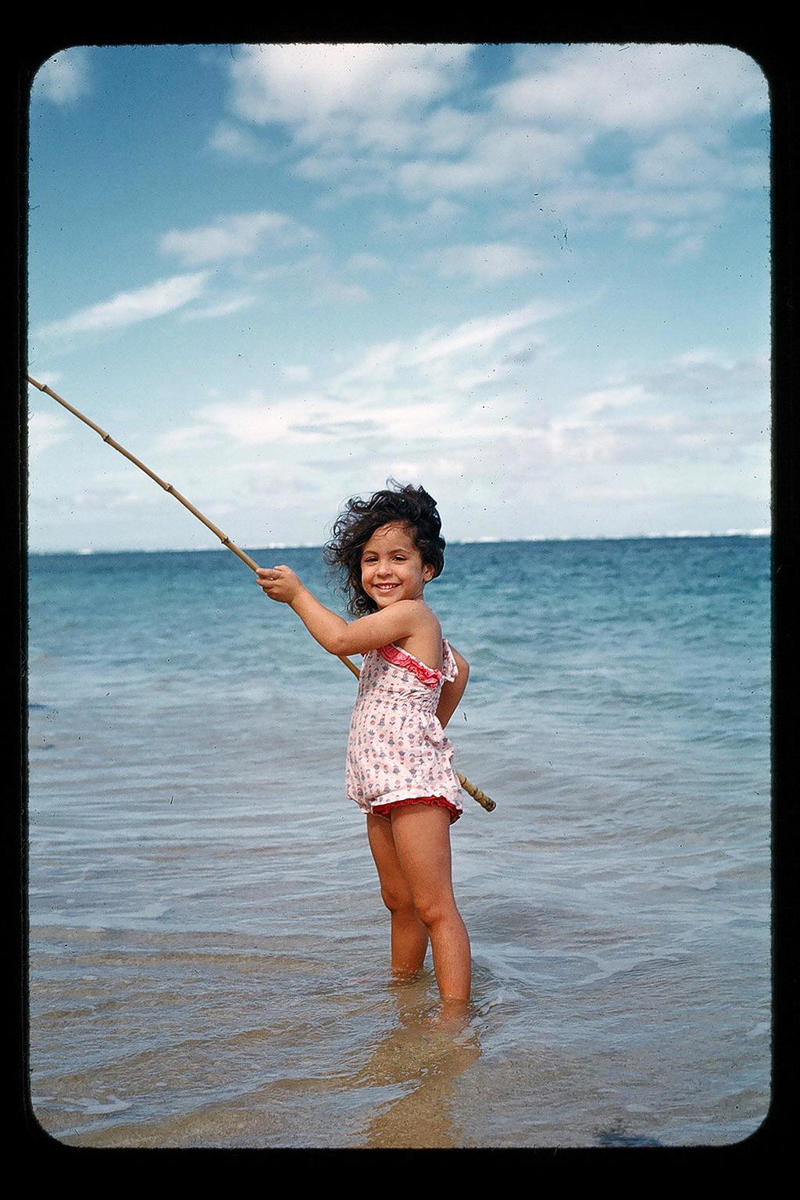 11. Little Girl Fishing on the North Shore of Oahu (1960) 1. Boys Setting Up Their Train Model (1946), 2. Dangerous Curves (1949), 3. Before Prom (1967), 4. Going for a Ride in the Convertible (1957), 5. Enjoying a Day at the Public Pool (1960s), 6. Mespelbrunn Castle in Bavaria, Germany, 7. Diving Contest in Palm Beach, Florida (1959), 8. Waiting on a Prom Date (1950s), 9. A Husband’s Portrait of His Wife (1954), 10. Times Square (1959), 11. Little Girl Fishing on the North Shore of Oahu (1960), 12. Couple on Vacation in Florida (1950s), 13. A Baker and His Bread (1950s), 14. Kids Posing by Their Family Vehicle (1966), 15. Brothers Playing in the Snow (1963), 16. Dogs Like Rides Too (1962), 17. Orphan Children from Mooseheart, Illinois (1948), 18. Stopping at Texaco on a Road Trip (1958), 19. Toddler Walking Around in Flowers (1954), 20. Boys on a Camping Trip (1965), 21. Saying Goodbye to Grandma (1950), 22. Picnic in France (1969), 23. A Night at the Bar (1950s), 24. Typical Teen Party (1978)