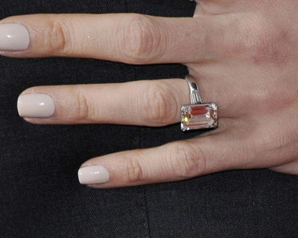 It features an emerald-cut diamond and tapered diamond baguettes., It’s worth an estimated .8 million today., It’s the second engagement ring she received from the prince., It’s inspired countless other celebrity engagement rings., Both rings are in the possession of Monaco’s royal family.