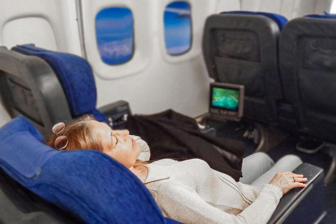 Eat the airplane food, Wear shorts, Drink the plane water, Use the blankets, pillows and mattresses, Go barefoot, Ignore the safety briefing, Sit in the last row, Have more than one alcoholic drink, Book the very last flight of the day, Wear contact lenses the whole flight, Keep the seat reclined during meal service, Put valuables in the seat pocket, Stand in the aisle right after landing, Eat right off the tray table, Assume your checked bag will arrive with you, About the experts, Why trust us, Sources: