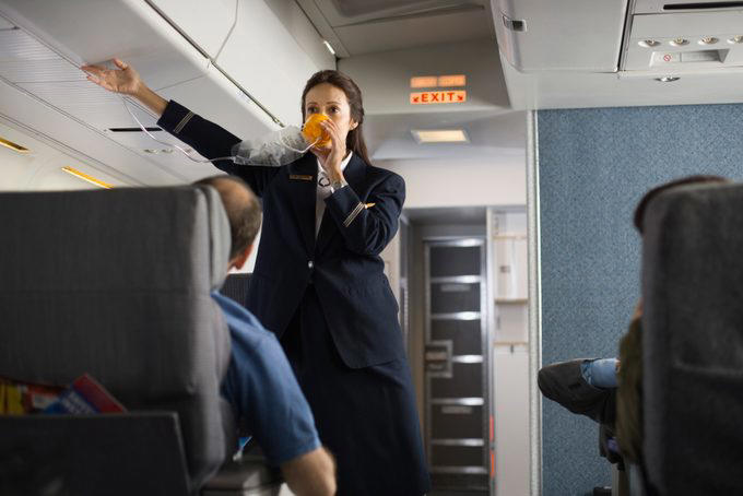 Eat the airplane food, Wear shorts, Drink the plane water, Use the blankets, pillows and mattresses, Go barefoot, Ignore the safety briefing, Sit in the last row, Have more than one alcoholic drink, Book the very last flight of the day, Wear contact lenses the whole flight, Keep the seat reclined during meal service, Put valuables in the seat pocket, Stand in the aisle right after landing, Eat right off the tray table, Assume your checked bag will arrive with you, About the experts, Why trust us, Sources: