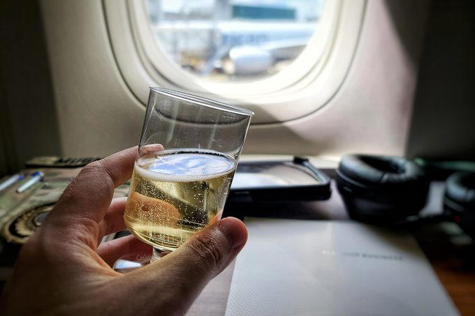 Eat the airplane food, Wear shorts, Drink the plane water, Use the blankets, pillows and mattresses, Go barefoot, Ignore the safety briefing, Sit in the last row, Have more than one alcoholic drink, Book the very last flight of the day, Wear contact lenses the whole flight, Keep the seat reclined during meal service, Put valuables in the seat pocket, Stand in the aisle right after landing, Eat right off the tray table, Assume your checked bag will arrive with you, About the experts, Why trust us, Sources: