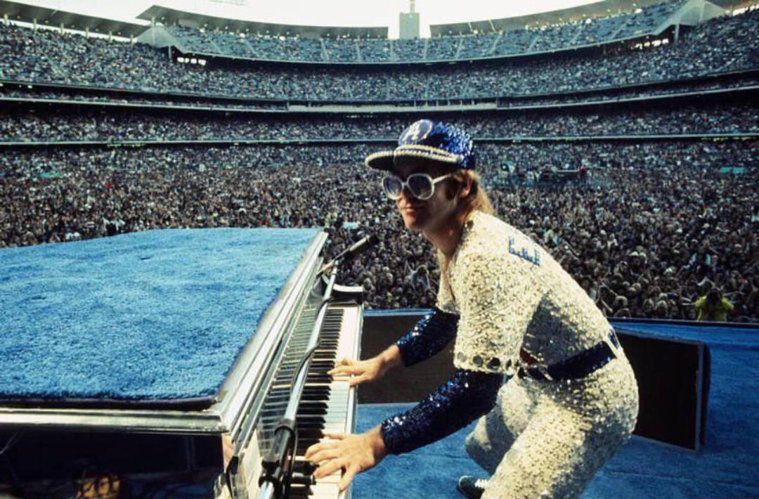 1. Patrick Stewart in 1975, 2. Elton John rocking out at a sold-out Dodger Stadium, 1975, 3. Led Zeppelin in their private jet, 'The Starship,' 1975, 4. A 17-year-old Prince at the beginning of his career, 1975, 5. Cher and Elton John at the Rock Music Awards, 1975, 6. David Bowie in New Mexico, 1975, 7. Chi Chi Rodriguez and his caddie, John Lynch, at the '75 masters, 8. Dolly Parton playing a show in 1975, 9. Steven Spielberg in Bruce the shark's mouth between scenes, 1975, 10. Nicholson's face after finding out the whole world thinks he's delicious, 11. This is what it looked like to be a DJ in the '70s, 12. Taking a break from filming "Monty Python and the Holy Grail," 1975, 13. Leo DiCaprio and his single mother pose in their home in Los Angeles, 1975, 14. Lombard Street in San Francisco, 1975, 15. Soldiers would write messages on their helmets in Vietnam, 1975, 16. Sally Field, 1975, 17. Stan Lee at the Comic Con of San Diego, 1975, 18. "My sister and her '66 GTO, 1975", 19. George Carlin doing a promo for his first appearance on SNL, 1975, 20. Too cool for school in Boston, 1975, 21. "My elementary school class of 1975, NYC", 22. Cher, 1975, 23. Stevie Nicks and her bodyguard Richard Norton, 1975, 24. The infamous photo of two brothers in Sequoia National Park moments before getting struck by lightning, 1975, 25. Connie and Jodie Foster, dressed in identical costumes for the film 'Taxi Driver,' 1975, 26. Cyber Man taking a much-needed break after a long day of filming, 1975, 27. One of the most rad bowling teams ever, 1975, 28. The original SNL cast, 1975, 29. Everyone has a happy face while dancing at the Disko-Club in East Germany, 1975, 30. "My mom at 16 with her Camaro, 1975", 31. Led Zeppelin, backstage in Indianapolis, 1975, 32. Muhammad Ali with 2-year-old Dave Chappelle and his brother William, 1975, 33. 47-year-old Robert Shaw on the set of Jaws, 1975, 34. Tim Curry taking a break while filming the Rocky Horror Picture Show, 1975, 35. Ron Howard's wedding to Cheryl was blessed with Henry Winkler's mustache, 1975, 36. Linda Ronstadt outside her family’s hardware store, Tucson, Arizona, 1975, 37. Sean Penn at Santa Monica High School, 1975, 38. Helen Mirren, 1975, 39. The perfect haircut did exist, 1975, 40. "My dad and his green Javelin, 1975", 41. Patrick Swayze and his wife, Lisa, who met as dance students, 42. Jon Voight and Raquel Welch at the '75 Oscars, 43. Students at Afghanistan’s second-largest university in the capital city of Kabul, 1975, 44. Martin Scorsese and De Niro on the set of Taxi Driver, 1975, 45. A Tonka truck was the best way to entertain yourself in 1975, 46. "My dad, somewhere at sea, 1975", 47. A young MC Hammer with baseball legend Hank Aaron, 1975, 48. Doing work on her car, 1975, 49. George Harrison meeting Bob Marley backstage in Los Angeles, 1975