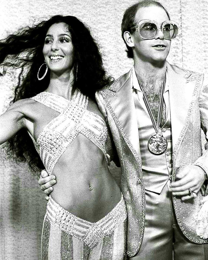 1. Patrick Stewart in 1975, 2. Elton John rocking out at a sold-out Dodger Stadium, 1975, 3. Led Zeppelin in their private jet, 'The Starship,' 1975, 4. A 17-year-old Prince at the beginning of his career, 1975, 5. Cher and Elton John at the Rock Music Awards, 1975, 6. David Bowie in New Mexico, 1975, 7. Chi Chi Rodriguez and his caddie, John Lynch, at the '75 masters, 8. Dolly Parton playing a show in 1975, 9. Steven Spielberg in Bruce the shark's mouth between scenes, 1975, 10. Nicholson's face after finding out the whole world thinks he's delicious, 11. This is what it looked like to be a DJ in the '70s, 12. Taking a break from filming "Monty Python and the Holy Grail," 1975, 13. Leo DiCaprio and his single mother pose in their home in Los Angeles, 1975, 14. Lombard Street in San Francisco, 1975, 15. Soldiers would write messages on their helmets in Vietnam, 1975, 16. Sally Field, 1975, 17. Stan Lee at the Comic Con of San Diego, 1975, 18. "My sister and her '66 GTO, 1975", 19. George Carlin doing a promo for his first appearance on SNL, 1975, 20. Too cool for school in Boston, 1975, 21. "My elementary school class of 1975, NYC", 22. Cher, 1975, 23. Stevie Nicks and her bodyguard Richard Norton, 1975, 24. The infamous photo of two brothers in Sequoia National Park moments before getting struck by lightning, 1975, 25. Connie and Jodie Foster, dressed in identical costumes for the film 'Taxi Driver,' 1975, 26. Cyber Man taking a much-needed break after a long day of filming, 1975, 27. One of the most rad bowling teams ever, 1975, 28. The original SNL cast, 1975, 29. Everyone has a happy face while dancing at the Disko-Club in East Germany, 1975, 30. "My mom at 16 with her Camaro, 1975", 31. Led Zeppelin, backstage in Indianapolis, 1975, 32. Muhammad Ali with 2-year-old Dave Chappelle and his brother William, 1975, 33. 47-year-old Robert Shaw on the set of Jaws, 1975, 34. Tim Curry taking a break while filming the Rocky Horror Picture Show, 1975, 35. Ron Howard's wedding to Cheryl was blessed with Henry Winkler's mustache, 1975, 36. Linda Ronstadt outside her family’s hardware store, Tucson, Arizona, 1975, 37. Sean Penn at Santa Monica High School, 1975, 38. Helen Mirren, 1975, 39. The perfect haircut did exist, 1975, 40. "My dad and his green Javelin, 1975", 41. Patrick Swayze and his wife, Lisa, who met as dance students, 42. Jon Voight and Raquel Welch at the '75 Oscars, 43. Students at Afghanistan’s second-largest university in the capital city of Kabul, 1975, 44. Martin Scorsese and De Niro on the set of Taxi Driver, 1975, 45. A Tonka truck was the best way to entertain yourself in 1975, 46. "My dad, somewhere at sea, 1975", 47. A young MC Hammer with baseball legend Hank Aaron, 1975, 48. Doing work on her car, 1975, 49. George Harrison meeting Bob Marley backstage in Los Angeles, 1975