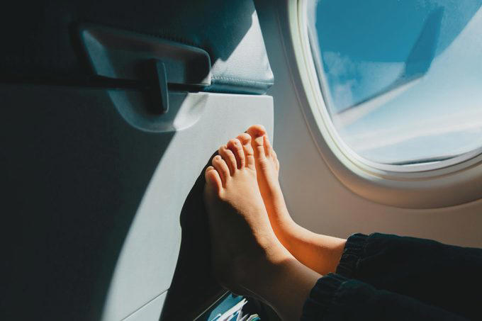 Eat the airplane food, Wear shorts, Drink the plane water, Use the blankets, pillows and mattresses, Go barefoot, Ignore the safety briefing, Sit in the last row, Have more than one alcoholic drink, Book the very last flight of the day, Wear contact lenses the whole flight, Keep the seat reclined during meal service, Put valuables in the seat pocket, Stand in the aisle right after landing, Eat right off the tray table, Assume your checked bag will arrive with you, About the experts, Why trust us, Sources: