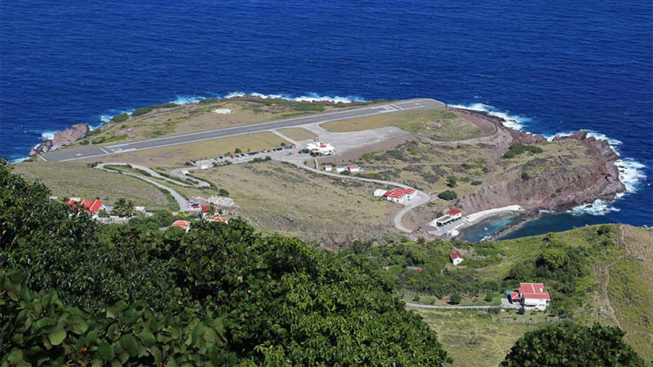 1. Lord Howe Island Airport, Australia Nestled on a remote island, this runway greets passengers with turquoise waters and lush greenery all around. The approach offers a serene glimpse of untouched natural beauty. (Image: Lord Howe Island Board), 2. Queenstown Airport, New Zealand Surrounded by the Southern Alps and pristine lakes, Queenstown’s runway is nothing short of dramatic. The towering mountains and deep blue waters make every landing a postcard-perfect moment. (Image: New Zealand), 3. Madeira Airport, Portugal Madeira’s airport runway is famed for its cliffside location and spectacular ocean views. The dramatic approach over the Atlantic makes landing here a thrilling experience. (Image: Canva), 3. Pitkin County Airport, USA Set in the heart of the Rocky Mountains, this Colorado runway is framed by snowy peaks and dense forests, offering a breathtaking sight as you touch down. (Image: Facebook/Aspen Airport), 5. Rio de Janeiro–Santos Dumont Airport, Brazil Landing here means swooping in over Rio’s iconic beaches, Sugarloaf Mountain, and the sparkling bay — a visual feast before you even step off the plane. (Image: Canva), 5. London City Airport, United Kingdom Though small and urban, London City Airport offers amazing views of London’s skyline, including the Shard, Tower Bridge, and the Thames, making the approach truly unique. (Image: London City Airport), 7. Innsbruck Airport, Austria Nestled in the Alps, Innsbruck’s runway is surrounded by snow-covered peaks and charming alpine villages. The challenging approach is as scenic as it is thrilling. (Image: Wikimedia), 8. Paro Airport, Bhutan One of the world’s most challenging landings, Paro Airport is set in a deep Himalayan valley. Passengers are treated to breathtaking views of mountain monasteries and rugged peaks. (Image: Canva), 9. Juancho E. Yrausquin Airport, Caribbean Netherlands Famous for its short runway and ocean on three sides, this airport in Saba offers a stunning tropical vista with turquoise waters just feet away from the tarmac. (Image: Wikipedia), 10. Daniel K. Inouye International Airport, USA Located in Honolulu, this runway is surrounded by palm trees, volcanic mountains, and sparkling Pacific waters — a tropical paradise from the moment you arrive. (Image: Wikipedia), 10. Lukla Airport, Nepal Known as the gateway to Everest, Lukla’s runway is perched on a steep mountain slope. The dramatic Himalayan backdrop makes this one of the most awe-inspiring landings in the world. (Image: Canva)