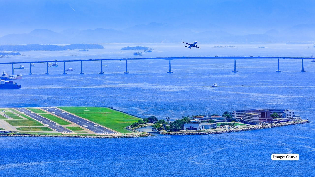 1. Lord Howe Island Airport, Australia Nestled on a remote island, this runway greets passengers with turquoise waters and lush greenery all around. The approach offers a serene glimpse of untouched natural beauty. (Image: Lord Howe Island Board), 2. Queenstown Airport, New Zealand Surrounded by the Southern Alps and pristine lakes, Queenstown’s runway is nothing short of dramatic. The towering mountains and deep blue waters make every landing a postcard-perfect moment. (Image: New Zealand), 3. Madeira Airport, Portugal Madeira’s airport runway is famed for its cliffside location and spectacular ocean views. The dramatic approach over the Atlantic makes landing here a thrilling experience. (Image: Canva), 3. Pitkin County Airport, USA Set in the heart of the Rocky Mountains, this Colorado runway is framed by snowy peaks and dense forests, offering a breathtaking sight as you touch down. (Image: Facebook/Aspen Airport), 5. Rio de Janeiro–Santos Dumont Airport, Brazil Landing here means swooping in over Rio’s iconic beaches, Sugarloaf Mountain, and the sparkling bay — a visual feast before you even step off the plane. (Image: Canva), 5. London City Airport, United Kingdom Though small and urban, London City Airport offers amazing views of London’s skyline, including the Shard, Tower Bridge, and the Thames, making the approach truly unique. (Image: London City Airport), 7. Innsbruck Airport, Austria Nestled in the Alps, Innsbruck’s runway is surrounded by snow-covered peaks and charming alpine villages. The challenging approach is as scenic as it is thrilling. (Image: Wikimedia), 8. Paro Airport, Bhutan One of the world’s most challenging landings, Paro Airport is set in a deep Himalayan valley. Passengers are treated to breathtaking views of mountain monasteries and rugged peaks. (Image: Canva), 9. Juancho E. Yrausquin Airport, Caribbean Netherlands Famous for its short runway and ocean on three sides, this airport in Saba offers a stunning tropical vista with turquoise waters just feet away from the tarmac. (Image: Wikipedia), 10. Daniel K. Inouye International Airport, USA Located in Honolulu, this runway is surrounded by palm trees, volcanic mountains, and sparkling Pacific waters — a tropical paradise from the moment you arrive. (Image: Wikipedia), 10. Lukla Airport, Nepal Known as the gateway to Everest, Lukla’s runway is perched on a steep mountain slope. The dramatic Himalayan backdrop makes this one of the most awe-inspiring landings in the world. (Image: Canva)
