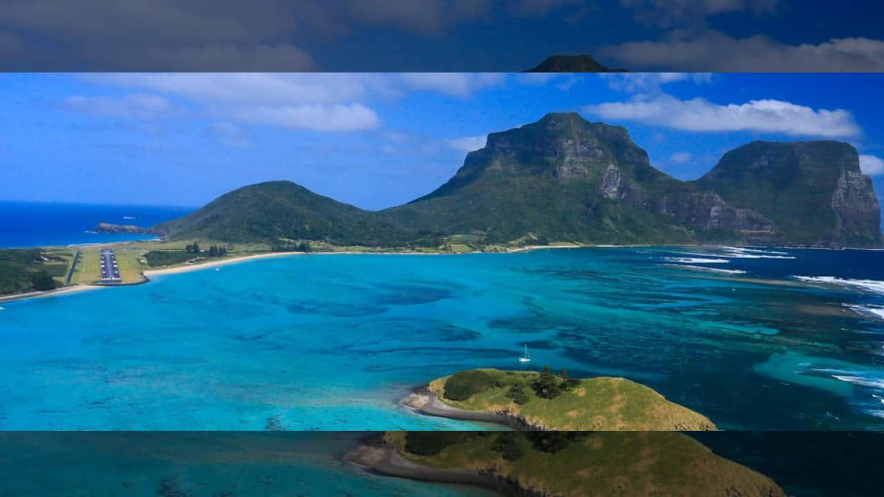 1. Lord Howe Island Airport, Australia Nestled on a remote island, this runway greets passengers with turquoise waters and lush greenery all around. The approach offers a serene glimpse of untouched natural beauty. (Image: Lord Howe Island Board), 2. Queenstown Airport, New Zealand Surrounded by the Southern Alps and pristine lakes, Queenstown’s runway is nothing short of dramatic. The towering mountains and deep blue waters make every landing a postcard-perfect moment. (Image: New Zealand), 3. Madeira Airport, Portugal Madeira’s airport runway is famed for its cliffside location and spectacular ocean views. The dramatic approach over the Atlantic makes landing here a thrilling experience. (Image: Canva), 3. Pitkin County Airport, USA Set in the heart of the Rocky Mountains, this Colorado runway is framed by snowy peaks and dense forests, offering a breathtaking sight as you touch down. (Image: Facebook/Aspen Airport), 5. Rio de Janeiro–Santos Dumont Airport, Brazil Landing here means swooping in over Rio’s iconic beaches, Sugarloaf Mountain, and the sparkling bay — a visual feast before you even step off the plane. (Image: Canva), 5. London City Airport, United Kingdom Though small and urban, London City Airport offers amazing views of London’s skyline, including the Shard, Tower Bridge, and the Thames, making the approach truly unique. (Image: London City Airport), 7. Innsbruck Airport, Austria Nestled in the Alps, Innsbruck’s runway is surrounded by snow-covered peaks and charming alpine villages. The challenging approach is as scenic as it is thrilling. (Image: Wikimedia), 8. Paro Airport, Bhutan One of the world’s most challenging landings, Paro Airport is set in a deep Himalayan valley. Passengers are treated to breathtaking views of mountain monasteries and rugged peaks. (Image: Canva), 9. Juancho E. Yrausquin Airport, Caribbean Netherlands Famous for its short runway and ocean on three sides, this airport in Saba offers a stunning tropical vista with turquoise waters just feet away from the tarmac. (Image: Wikipedia), 10. Daniel K. Inouye International Airport, USA Located in Honolulu, this runway is surrounded by palm trees, volcanic mountains, and sparkling Pacific waters — a tropical paradise from the moment you arrive. (Image: Wikipedia), 10. Lukla Airport, Nepal Known as the gateway to Everest, Lukla’s runway is perched on a steep mountain slope. The dramatic Himalayan backdrop makes this one of the most awe-inspiring landings in the world. (Image: Canva)