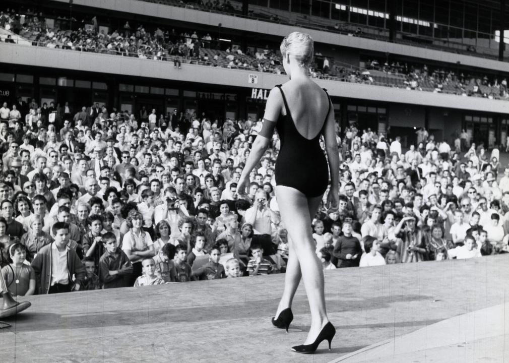 A Lone Contestant in Focus First Man on the Moon, Women’s Liberation Movement, Equal Pay Conference, A Lone Contestant in Focus, Champion Among Peers, Billie Jean King Celebrates Victory, Twiggy, Face of a New Era, Hugh Hefner with His Bunnies, The Kennedys Enjoy a Summer Afternoon, Urban Girls Show Off Summer Style, Four Girls, Four Styles, Friends, Beach, and Beats, Poolside Poker Night, Playful Moments by the Sea, Black Students Register to Vote, Martin Luther King at the Civil Rights Act Signing, Woolworth’s Desegregated, Summer of Love Vibes, Jimi Hendrix Arrives, George Harrison at a Festival, The Beatles Drop ‘Sgt. Pepper’, Segregation at the Pool, Heading Home After a Beach Day, Kids Running a Lemonade Stand, Hemlines Get Shorter, Family BBQ Gathering, Cooling Off in the Heat, Marsha Hunt, Activist and Actress, Nun Joining the Fun, Apollo 11 Crew