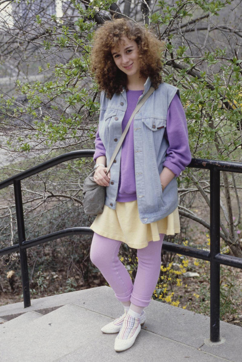 Big Hair and Pastels Vivid Colors, Early Hip Hop Styles, Big Hair, The Post-punk Aesthetic, Turtlenecks, Friends Wearing Matching Outfits, The Jazzercise Look, Shoulder Pads Fit For Linebackers, Jeans And Pants With High Waistlines, Stark Black and White, Short Shorts, Tights And Leotards, Streamlined Athletic Attire, Off-The-Shoulders Tops, Leggings For Aerobics And Style, Spiky Women's Hair, Sequinned Wardrobes, Tassels On Everything, The New York Aesthetic, T-Shirts With Graphics, Gigantic Sunglasses, Big Hair and Pastels, Fashion Gloves, Leather Dresses, Louis Vuitton Jackets And Accessories, Pop Music Went Punk, Cowboy Boots Worn Off The Ranch, Lingerie Worn As Part Of An Outfit, Gawdy Pearls And Jewelry, Real And Faux Feathers, Pouffy and Puffy Accessories, 2-Piece Skirt Suits, Preppy Dressing, Thick Belts With Mini Skirts, Double Blue Denim Outfits, High Top Sneakers And Thick Socks, Acid-Wash Jeans, Fingerless Neon Gloves, Scrunchies, Oversized Earrings In Bright Neon Colors, Ripped Knees On Jeans And Pants, Athletic Tops And Tanks, Knee-High Socks, Ankle Boots, Overalls, Track Suits And Windbreakers