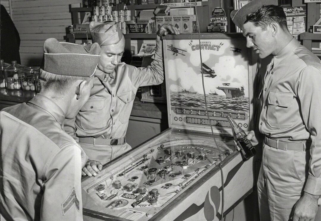 1. Country Store in Oklahoma (1940), 2. Uncle Newt’s Store in Hardin, Tennessee (1945), 3. Woman Looking in a ‘Men Only’ Machine at the Vermont Country Store (1954), 4. Checking Out at a Lynchburg, Tennessee, Store (1972), 5. Double Decker Store in Prospect Hill, North Carolina (1940), 6. McLeary Store, Outside of Salem, Oregon (1959), 7. W.B. Queen, a Fiddler, Playing in a Country Store in Tellico Plains, Tennessee (1941), 8. Soldiers From Fort Benning Playing Pinball in an Alabama Country Store (1941), 9. Putting Ice in the Soft Drink Refrigerator at a Store in Arkansas (1938), 10. General Store in Bigheart, Oklahoma (1908), 11. Grinding Coffee at the General Store in Castolon, Texas (1939), 12. Poolroom at the General Store in Granville County, North Carolina (1940), 13. Manning the Counter (1973), 14. General Store in Moundville, Alabama (1936), 15. Dowd’s Store in Fibre, Michigan (1952), 16. Farm Boy at a General Store Pop Stand in Iowa (1939), 17. Country Store Off a Dirt Road in North Carolina (1939)