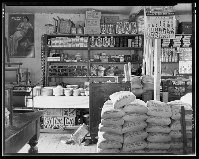 1. Country Store in Oklahoma (1940), 2. Uncle Newt’s Store in Hardin, Tennessee (1945), 3. Woman Looking in a ‘Men Only’ Machine at the Vermont Country Store (1954), 4. Checking Out at a Lynchburg, Tennessee, Store (1972), 5. Double Decker Store in Prospect Hill, North Carolina (1940), 6. McLeary Store, Outside of Salem, Oregon (1959), 7. W.B. Queen, a Fiddler, Playing in a Country Store in Tellico Plains, Tennessee (1941), 8. Soldiers From Fort Benning Playing Pinball in an Alabama Country Store (1941), 9. Putting Ice in the Soft Drink Refrigerator at a Store in Arkansas (1938), 10. General Store in Bigheart, Oklahoma (1908), 11. Grinding Coffee at the General Store in Castolon, Texas (1939), 12. Poolroom at the General Store in Granville County, North Carolina (1940), 13. Manning the Counter (1973), 14. General Store in Moundville, Alabama (1936), 15. Dowd’s Store in Fibre, Michigan (1952), 16. Farm Boy at a General Store Pop Stand in Iowa (1939), 17. Country Store Off a Dirt Road in North Carolina (1939)