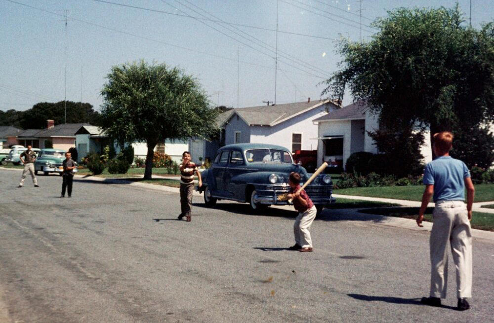 1. Kids Playing in the Streets of Brooklyn, New York, 1950, 2. Neighborhood Baseball on a Quiet Suburban Street, 1958, 3. Neighborhood Bike Gang, 1970s, 4. ‘Kids Playing Outside in Dumont, New Jersey, 1977’, 5. Homemade Playground in an Alley, 1950, 6. Someone Give This Kid a Stuntman Career, 1980s, 7. Children Playing on Peace Street in London’s East End, 1950s, 8. Just Some Friends Turning an Old Barrel Into the Perfect Playground, 9. This Jungle Gym Would Certainly Not Fly Today, 1942, 10. Scaling Brick Walls in Abandoned Building Was Just Part of the Fun, 11. Skater Boys Unite! New Jersey, Late ’80s, 12. A Police Officer Plays Tag With Local Kids in Harlem, New York, 1978, 13. Neighborhood War Games With Makeshift Weapons, 1960s, 14. Cutest Repair Shop I Ever Did See, 15. ‘Neighborhood Kids Playing War in Washington D.C., 1942’, 16. Just Some Buddies Hanging Out in Sydney, Australia, 1989, 17. Summertime Fun With a Shopping Cart, Harlem, New York, 1980s, 18. There’s a New Sheriff in Town and He Ain’t Playing Around, 19. ‘Kids Playing Street Hockey, 1976’
