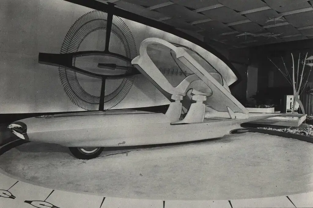 1. Hovertrains, 2. Personal Monorail Pods, 3. Jetpacks, 4. Airships, 5. Gyrocar, 6. Pneumatic Tube Transport, 7. Amphibious Cars, 8. Streetcars with Beachside Tracks, 9. Rail Zeppelins, 10. Sail-Powered Ice Sleds, 11. Travelators for City Streets, 12. Atomic-Powered Cars