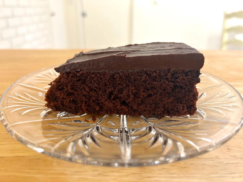 Garten's chocolate cake was deliciously moist, but it couldn't compete with some of her other desserts. Garten's chocolate cake features cocoa powder, espresso powder, and "good" vanilla., You'll also need some ingredients for the mocha frosting., I also prepped my dry ingredients ..., … and my chocolate-and-coffee mixture., It was time to start the batter., Then I added the vanilla and eggs., My cake batter was ready!, While my cake was cooling, I began making the frosting., I also prepped the cream., Once the cream was ready, I poured it over the chocolate mixture., Then I stirred in the Kahlúa and vanilla., I covered my frosting and refrigerated it for 30 minutes., It was time to frost my cake., Garten's chocolate cake with mocha icing tasted rich and decadent.