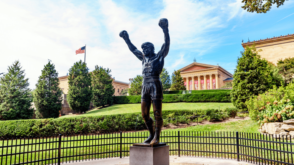 #1: The Rocky Steps – Rocky (1976) (Philadelphia, PA) #1: The Rocky Steps – Rocky (1976) (Philadelphia, PA), #3: Monument Valley – Stagecoach (1939) and Many Westerns (UT/AZ Border), #4: The Stanley Hotel – The Shining (1980) (Estes Park, CO), #7: Tatooine Sets – Star Wars (1977) (Tunisia), #9: Katz’s Delicatessen – When Harry Met Sally (1989) (New York City, NY), #10: Downtown Savannah – Forrest Gump (1994) (Savannah, GA), #12: Highclere Castle – Downton Abbey (2010–2015) (Hampshire, England), #13: Oxford University – The Theory of Everything (2014), Harry Potter (2001–2011), #15: Griffith Observatory – Rebel Without a Cause (1955), La La Land (2016) (Los Angeles, CA), #16: Timberline Lodge – The Shining (1980) (Mt. Hood, OR), #18: The Bench at Notting Hill – Notting Hill (1999) (London, England), #19: The Beach – The Goonies (1985) (Cannon Beach, OR), #21: Baker Street – Sherlock Holmes (2009) (London, England), #22: Skellig Michael – Star Wars: The Last Jedi (2017) (Ireland), #24: Rydell High – Grease (1978) (Venice High School, Los Angeles, CA), #25: Bodega Bay – The Birds (1963) (Bodega, CA)