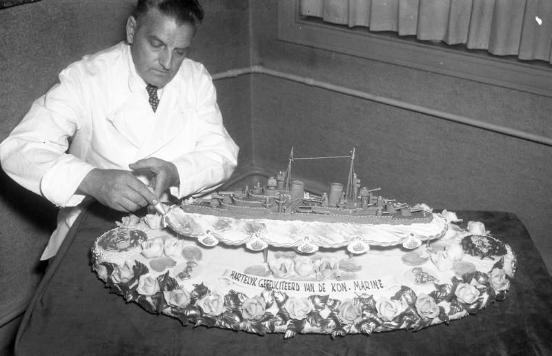 23. Maurice Chevalier's musical cake, 1956, 22. Hank Aaron's baseball tableau cake, 1973, 21. A super-sized sombrero cake, 1933, 20. Pavarotti's artistic cake portrait, 1980, 19. Ingrid Bergman and Charles Boyer's joint birthday cake, 1946, 18. Denise Grey's dual pink birthday cakes, 1985, 17. An elaborate Alice in Wonderland cake, 1932, 16. Shirley Temple's seventh birthday cake, 1936, 15. An extravagant Arc de Triomphe cake, 1983, 14. Glen Campbell's lifelike guitar cake, 1973, 13. A gravity-defying hot air balloon cake, 1933, 12. Elizabeth Taylor's front page cake, 1982, 11. Chuck Berry's rock 'n' roll cake, 1986, 10. Prince Charles' regal 40th birthday cake, 1988, 9. Princess Irene's nautical cake, 1951, 8. An architectural birthday cake, 1981, 7. Queen Charlotte's giant birthday cake, 1930, 6. Franklin D. Roosevelt's monumental birthday cake, 1940, 5. Winston Churchill's 80th birthday cake, 1954, 4. Harry Truman's five-tier birthday cake, 1954, 3. Charlie Chaplin's five-foot birthday cake, 1966, 2. John F. Kennedy's 44th birthday cake, 1961