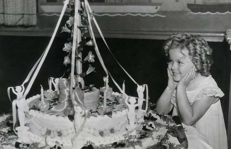 23. Maurice Chevalier's musical cake, 1956, 22. Hank Aaron's baseball tableau cake, 1973, 21. A super-sized sombrero cake, 1933, 20. Pavarotti's artistic cake portrait, 1980, 19. Ingrid Bergman and Charles Boyer's joint birthday cake, 1946, 18. Denise Grey's dual pink birthday cakes, 1985, 17. An elaborate Alice in Wonderland cake, 1932, 16. Shirley Temple's seventh birthday cake, 1936, 15. An extravagant Arc de Triomphe cake, 1983, 14. Glen Campbell's lifelike guitar cake, 1973, 13. A gravity-defying hot air balloon cake, 1933, 12. Elizabeth Taylor's front page cake, 1982, 11. Chuck Berry's rock 'n' roll cake, 1986, 10. Prince Charles' regal 40th birthday cake, 1988, 9. Princess Irene's nautical cake, 1951, 8. An architectural birthday cake, 1981, 7. Queen Charlotte's giant birthday cake, 1930, 6. Franklin D. Roosevelt's monumental birthday cake, 1940, 5. Winston Churchill's 80th birthday cake, 1954, 4. Harry Truman's five-tier birthday cake, 1954, 3. Charlie Chaplin's five-foot birthday cake, 1966, 2. John F. Kennedy's 44th birthday cake, 1961