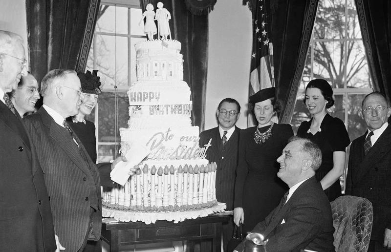 23. Maurice Chevalier's musical cake, 1956, 22. Hank Aaron's baseball tableau cake, 1973, 21. A super-sized sombrero cake, 1933, 20. Pavarotti's artistic cake portrait, 1980, 19. Ingrid Bergman and Charles Boyer's joint birthday cake, 1946, 18. Denise Grey's dual pink birthday cakes, 1985, 17. An elaborate Alice in Wonderland cake, 1932, 16. Shirley Temple's seventh birthday cake, 1936, 15. An extravagant Arc de Triomphe cake, 1983, 14. Glen Campbell's lifelike guitar cake, 1973, 13. A gravity-defying hot air balloon cake, 1933, 12. Elizabeth Taylor's front page cake, 1982, 11. Chuck Berry's rock 'n' roll cake, 1986, 10. Prince Charles' regal 40th birthday cake, 1988, 9. Princess Irene's nautical cake, 1951, 8. An architectural birthday cake, 1981, 7. Queen Charlotte's giant birthday cake, 1930, 6. Franklin D. Roosevelt's monumental birthday cake, 1940, 5. Winston Churchill's 80th birthday cake, 1954, 4. Harry Truman's five-tier birthday cake, 1954, 3. Charlie Chaplin's five-foot birthday cake, 1966, 2. John F. Kennedy's 44th birthday cake, 1961