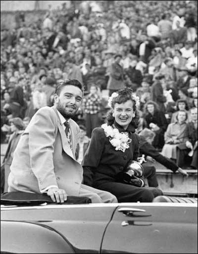 13. Pulling Up to Homecoming in Style (1957) 1. Homecoming With the Girls (1977), 2. Homecoming Court Looking Snazzy (1970s), 3. Check out That Red Suit (1974), 4. Groovy Homecoming Date (1975), 5. Homecoming Dance at Willow Run High School in Ypsilanti, Michigan (1971), 6. Football Player at His Homecoming Game (1978), 7. Colorful Garb (1970s), 8. Getting Crowned Queen at an Alabama High School (1971), 9. Homecoming Court at St. Joseph High School (1964), 10. Candidates for Queen at a California High School (1974), 11. Getting a Good Vantage Point of the Homecoming Parade (1971), 12. University of Florida Homecoming (1954), 13. Pulling Up to Homecoming in Style (1957), 14. Homecoming Queen Contestants (1969), 15. Homecoming Queen Being Crowned (1969), 16. Getting Ready to Head to the Game (1988), 17. Homecoming Court from Woodlawn High School in Shreveport, Louisiana (1971)
