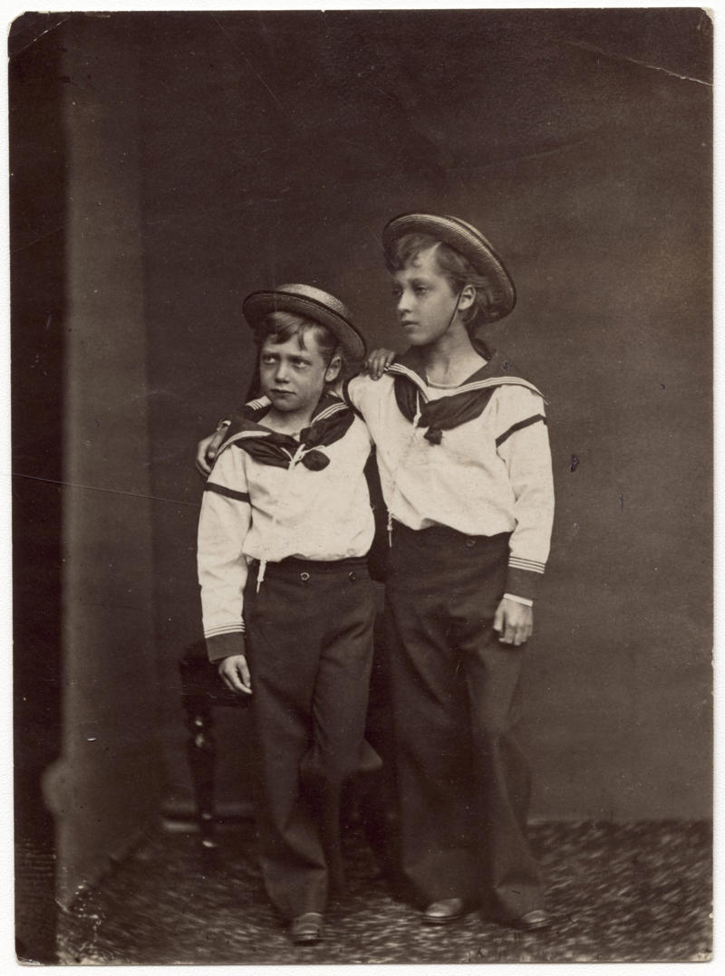 George V, with his older brother, Albert Victor George V, the Prince Harry of his time, George V, with his older brother, Albert Victor, George V's kids, including two future kings, Future (and now former) King Edward VIII, with his great-grandmum, Victoria, Wallis Simpson, before she became the Duchess of Windsor, Baby Queen Elizabeth II with her parents, A rare swimsuit photo of Elizabeth II, Lady Diana Spencer as a schoolteacher, Princess Margaret with nephew, the Prince of Wales, A somber moment, Grandmum's birthday, Princess Beatrice and Princess Eugenie in Miami, Royally cute
